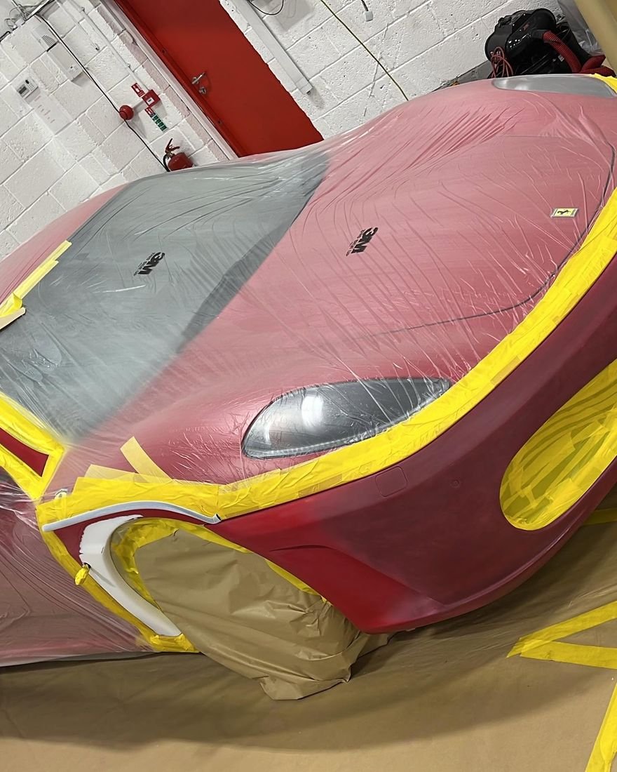 Before: Ferrari masked for paint, then finished